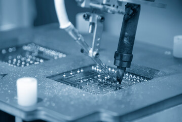 The automatic soldering machine operation with PCB board.