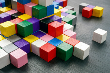 Fototapeta na wymiar Colorful blocks as an abstract symbol of complex structure, interaction and diversity.