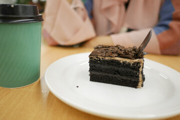 chocolate and cream cake on a plate on table 