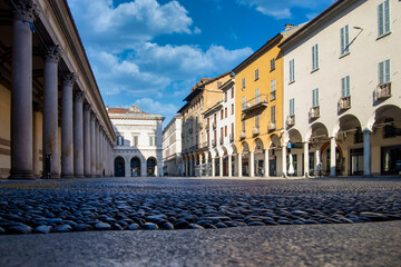 Piazza della Repubblica in Novara with its historic buildings and the portico of the cathedral, Novara, Piedmont, Italy