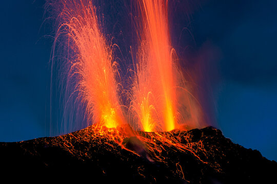 Lava bombs erupt from multiple vents on volcano, active for at least 2000 years, Stromboli, Aeolian Islands, UNESCO World Heritage Site, Sicily, Italy