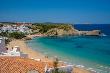 View of beach and rooftops in Arenal d'en Castell, Es Mercadal, Menorca, Balearic Islands, Spain