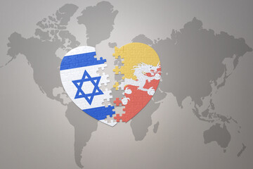 puzzle heart with the national flag of bhutan and israel on a world map background.Concept.
