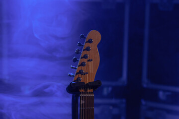 Close-up of the electric guitar neck on stage
