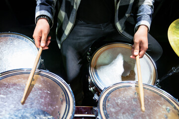 Close-up of the drummer's hands with sticks
