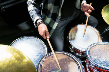 Close-up of the drummer's hands with sticks