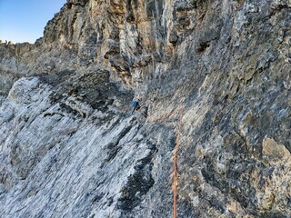 Mountaineering in extremely steep terrain. Climbing on the Bifertenstock in Swiss Alps. Extreme sports. Wanderlust. High quality photo
