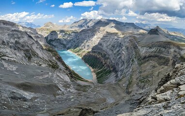 Fantastic view of the Limmernsee reservoir in the Swiss mountains. Mountain lake in the Alps surrounded by the glaciers.