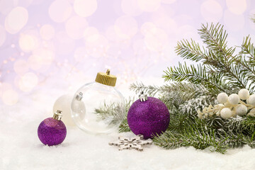 Fototapeta na wymiar Christmas decorations under a fir tree on white snow.