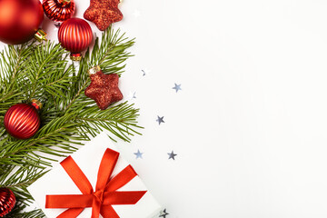 Christmas card with fir branches and Christmas decorations.