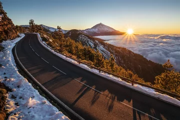 Aluminium Prints Canary Islands Beautiful view of the road surrounded by snow volcano on the Teide volcano background