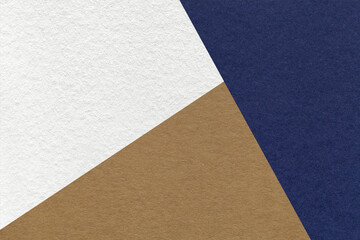 Texture of craft navy blue, white and brown shade color paper background, macro. Vintage abstract indigo cardboard
