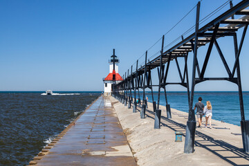 Boat coming in the channel at St. Joseph North Pier Lighthouse, Michigan