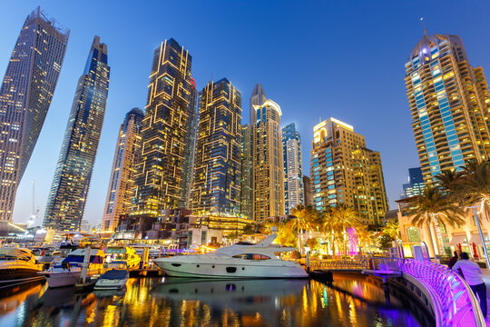 Dubai Marina skyline yacht harbor architecture travel at night twilight in United Arab Emirates
