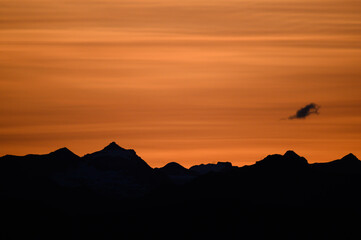 Silhouetted Mountain Horizon Line At Sunrise Sunset
