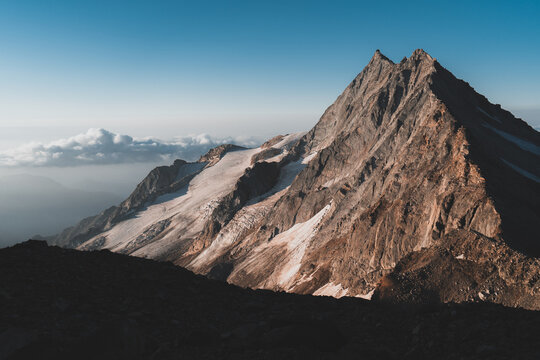 Pizzo d'Andolla and Portjengrat at Sunrise above clouds