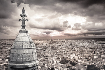 Above Paris from Sacre Couer tower in Montmartre with dramatic sky, France