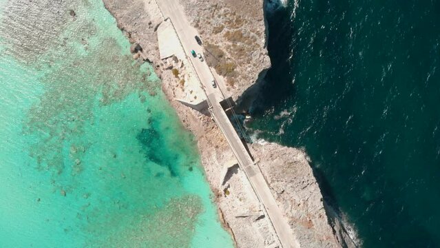 Drone footage of the Glass Window Bridge in the Bahamas. Turquoise water of Eleuthera and Atlantic.