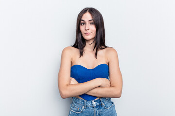 Young caucasian woman isolated on white background suspicious, uncertain, examining you.