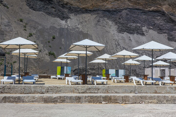 Beach umbrellas and deck chairs on the beach