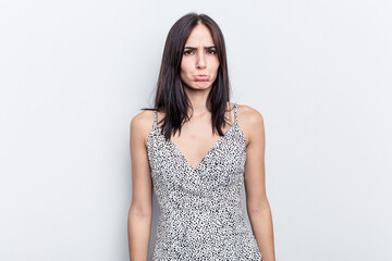 Naklejka premium Young caucasian woman isolated on white background sad, serious face, feeling miserable and displeased.