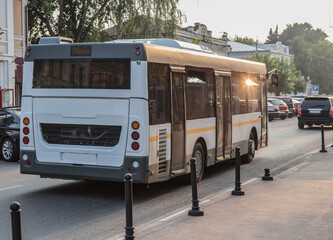 bus moves along the city street.