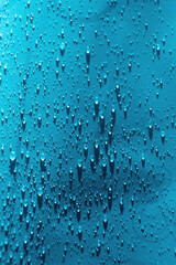 Naklejka na ściany i meble Water drops background. Droplet splash rain texture. Drop splash water pattern. Selective focus.