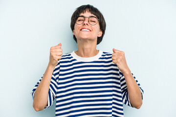 Fototapeta premium Young caucasian woman with a short hair cut isolated celebrating a victory, passion and enthusiasm, happy expression.