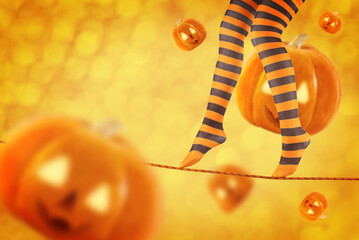 Women's legs in striped stockings on a Halloween holiday background