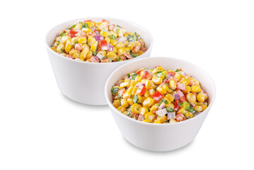 Mexican street corn salad in a bowl on a white isolated background