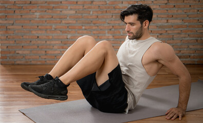 Young hansome man workout fitness exercise at home gym
