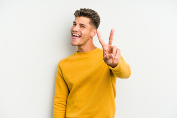 Young caucasian man isolated on white background showing number two with fingers.