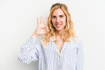 Young caucasian woman isolated on white background cheerful and confident showing ok gesture.