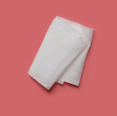 Sheet white toilet paper on pink background