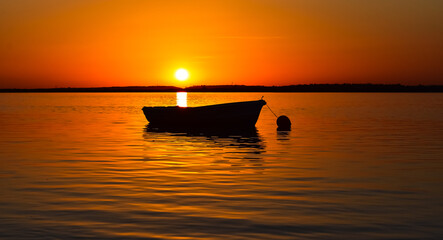 Boat in the sea with beautiful sunset