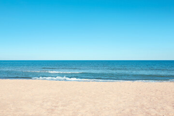 Picturesque view of sandy beach near sea - obrazy, fototapety, plakaty
