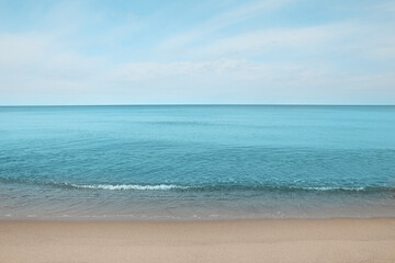 Fototapeta na wymiar Beautiful view of sea shore under blue sky on sunny day