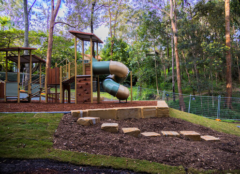 Kids playground with swings and a slide