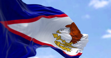 The American Samoa flag in the wind on a clear day