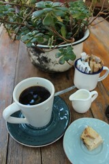 Obraz na płótnie Canvas Coffee with milk on a wooden table