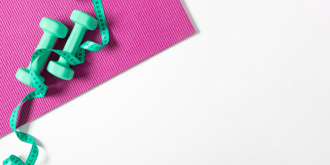 Yoga mat, measuring tape and dumbbells on white background. Healthy lifestyle. Flat lay, top view,...