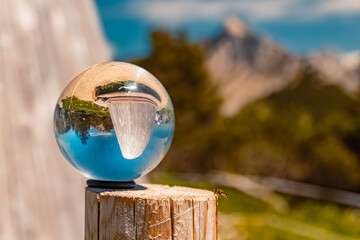 Crystal ball alpine summer landscape shot at the famous Fuessener Joechle summit, Tannheim, Tyrol,...