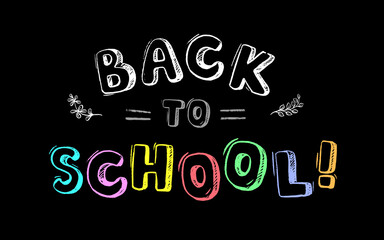 The inscription in colored chalk on the blackboard - back to school!