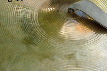 Gold cymbal up close - Powered by Adobe