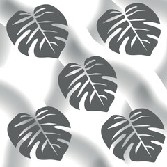 seamless background with palm leaves on a gray background. A spectacular pattern for decoration.