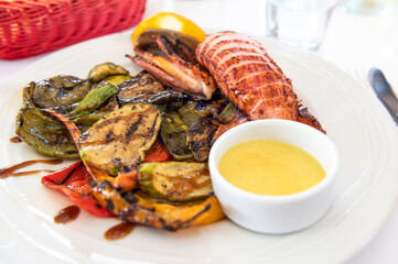 Grilled vegetables and squid, calamari served in Greek tavern, traditional greece food