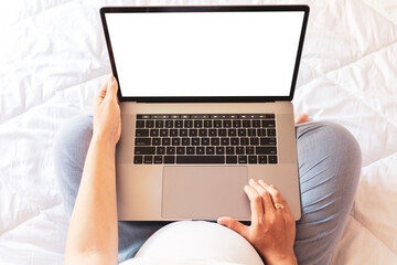Obraz na płótnie Canvas Pregnancy screen mockup. Mobile pregnancy online maternity notebook mock up. Pregnant mother using notebook. Concept of pregnancy, maternity, expectation for baby birth.
