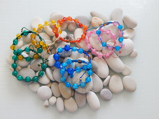 Hippie colorful bracelet on sea stones
