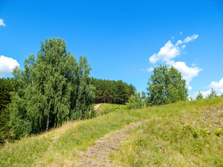 Fototapeta na wymiar Landscape with hills and blue sky