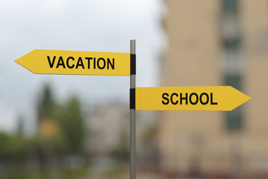 Crossroad signpost showing vacation and school, 3D render